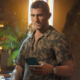 Jason, one of the protagonists of GTA 6, holding a phone.