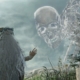 A giant skeleton looking at the Revenant