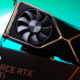 An Nvidia RTX 3080 Ti Founders Edition on top of its box on a blue background